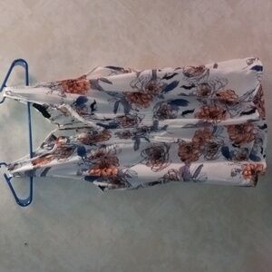 Floral sleeveless blouse. It's an extra large and it's by sanctuary.
